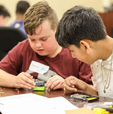 Kids actively engaged in educational activities in After The Peanut's STEAM Education Program